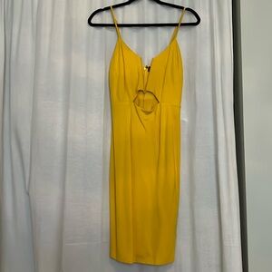 Yellow body-con dress with front cutout. NWT